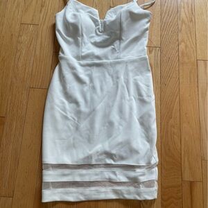 White bodycon dress with cami straps and netting detail
